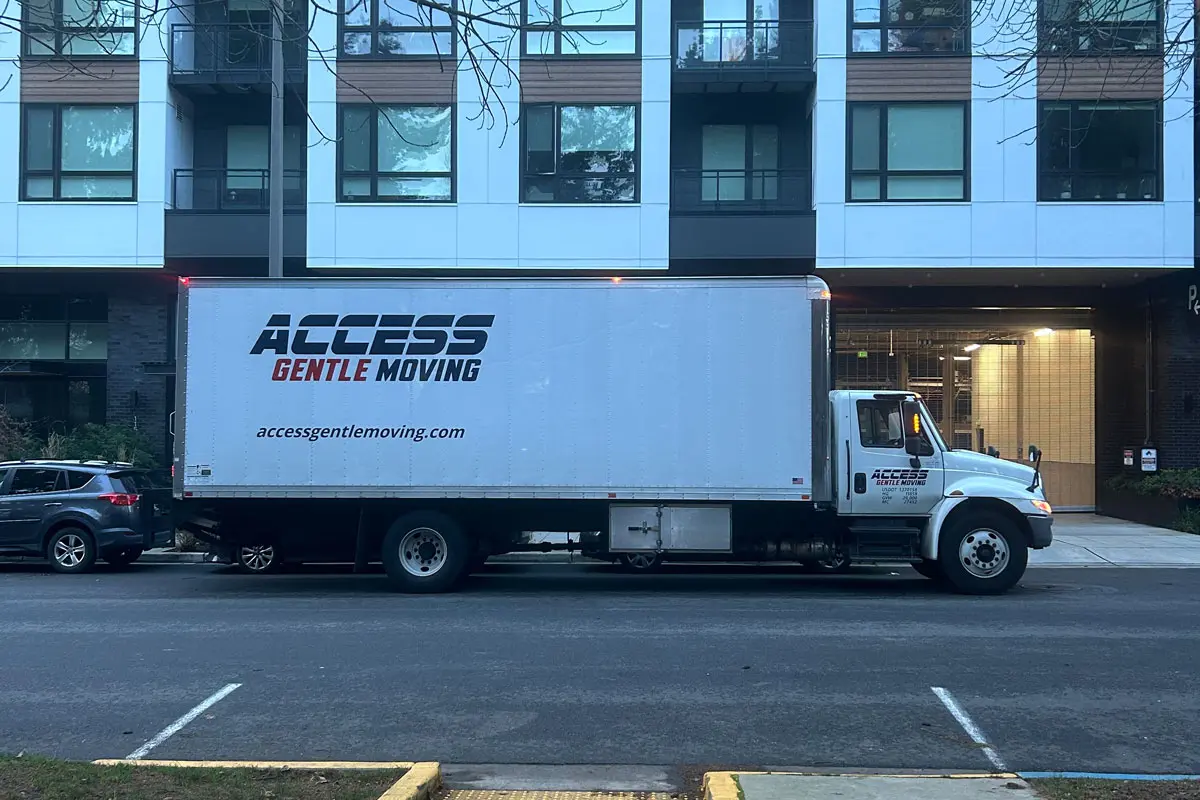 Access Gentle Moving truck outside a residential building